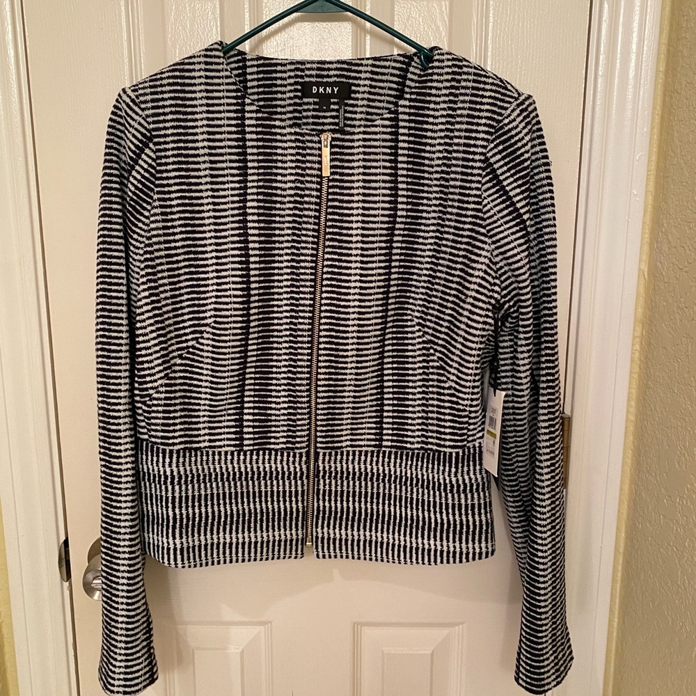 Never worn, tags attached. DKNY navy blue and white waist length zip up blazer.
